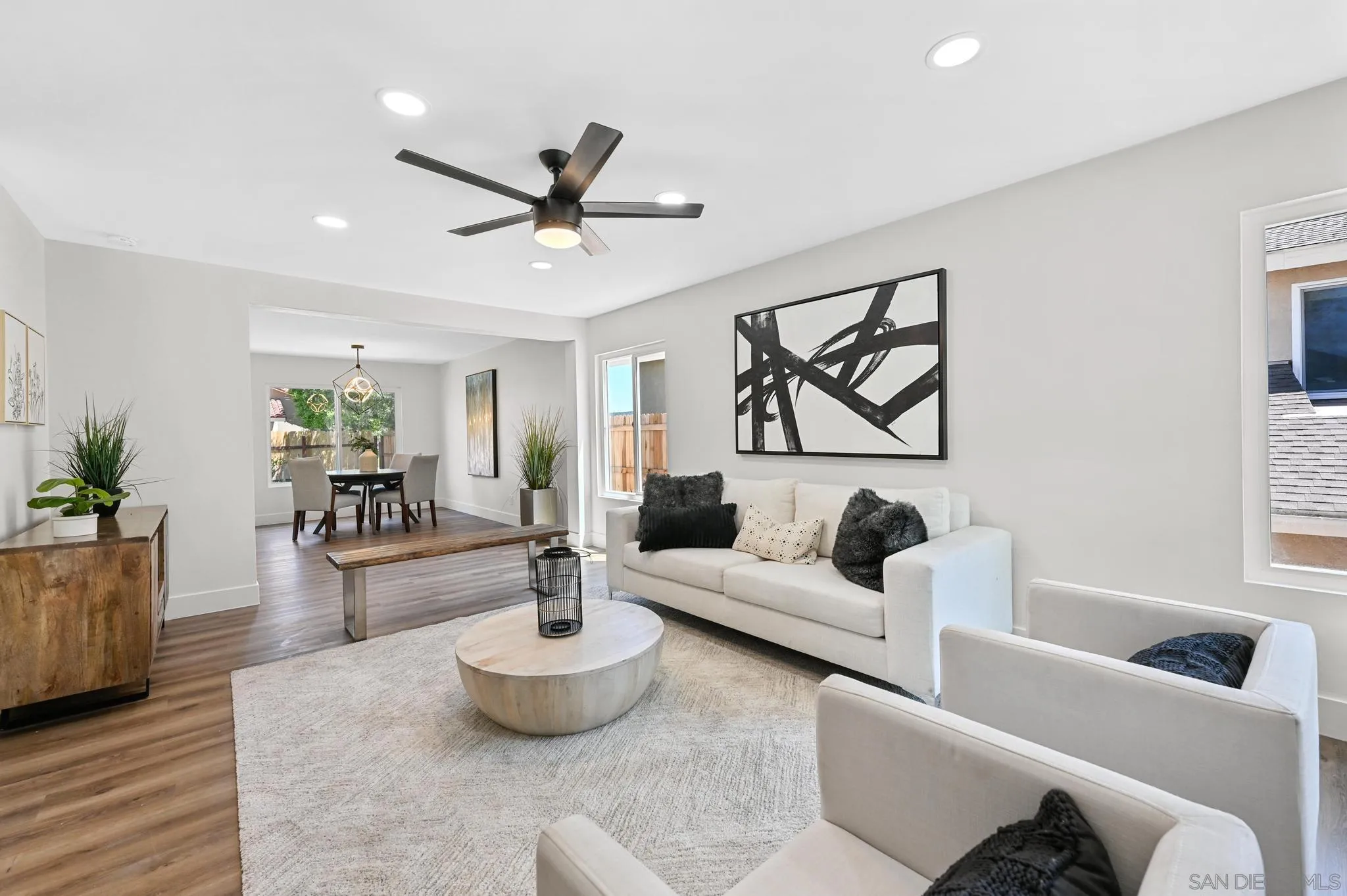 14463 Janal Way San Diego, CA 92129 - Photo 7 of 44 a living room with furniture and a potted plant