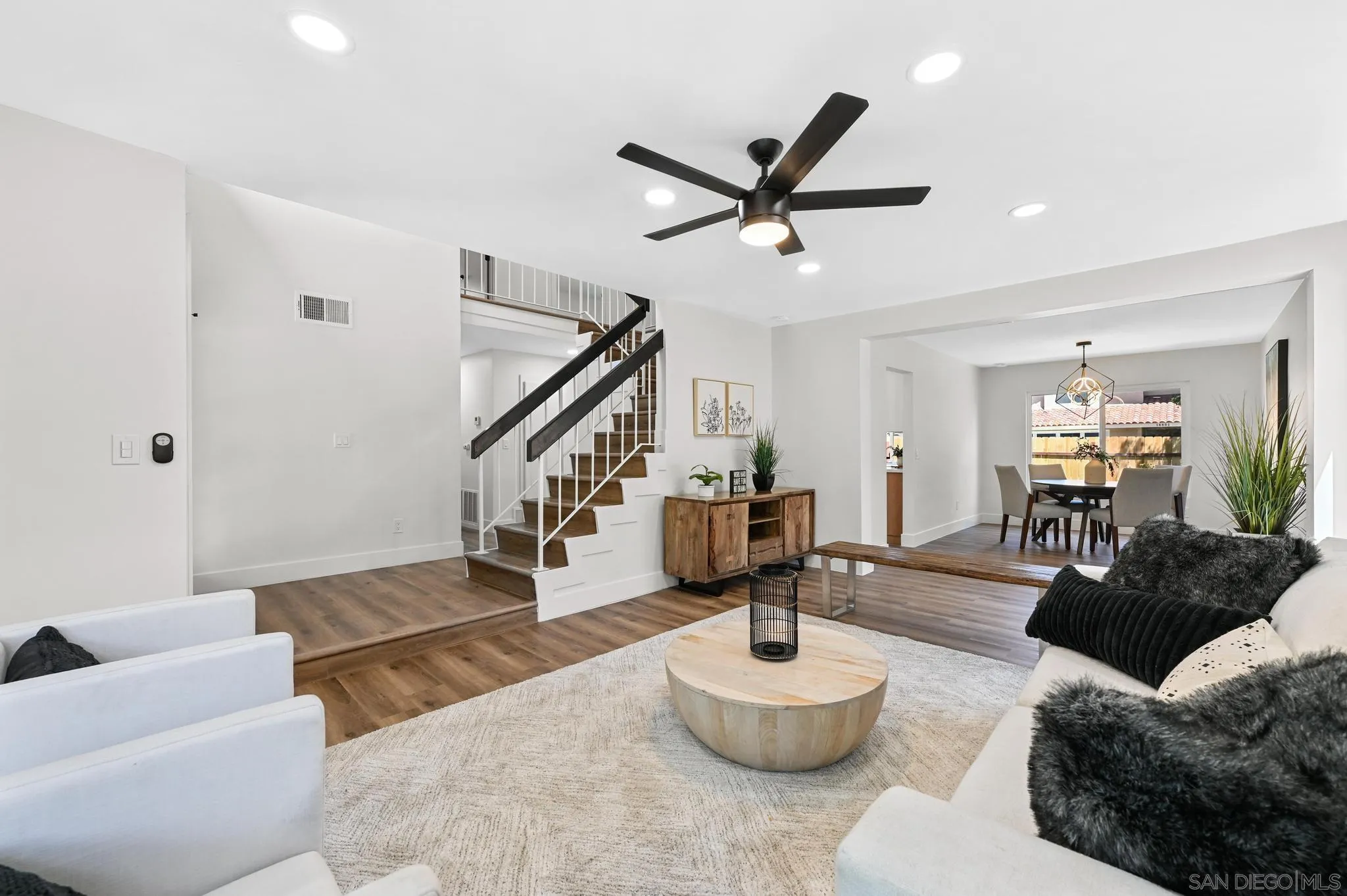 14463 Janal Way San Diego, CA 92129 - Photo 8 of 44 a living room with furniture and a potted plant
