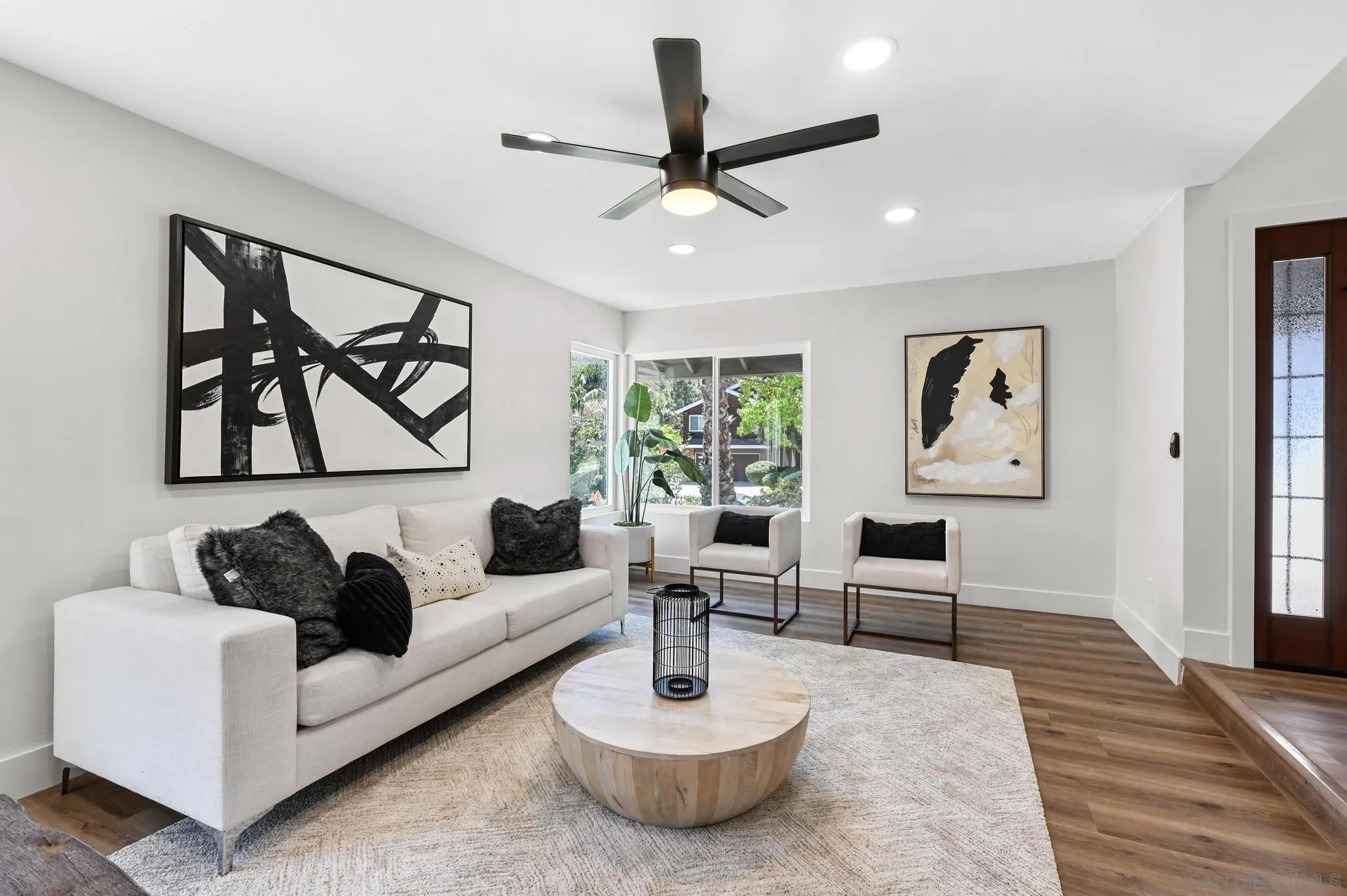 14463 Janal Way San Diego, CA 92129 - Photo 9 of 44 a living room with furniture and a large window