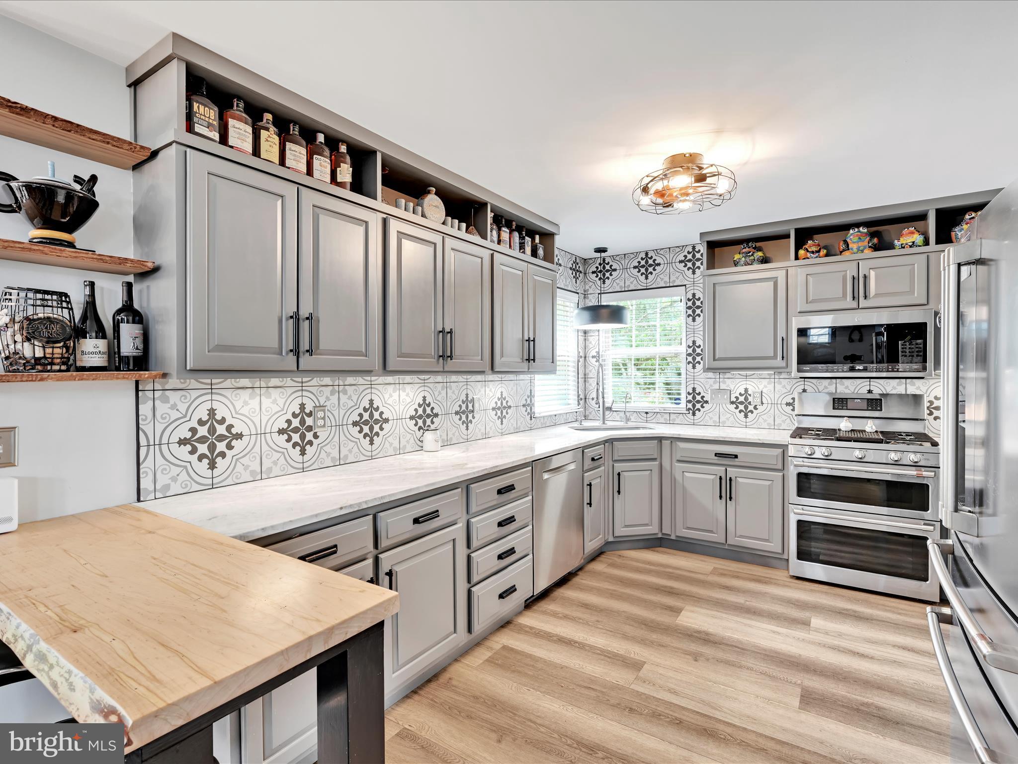 2518 Jacob Drive Reading, PA 19608 - Photo 12 of 41 a kitchen with stainless steel appliances granite countertop a kitchen island a stove and a sink