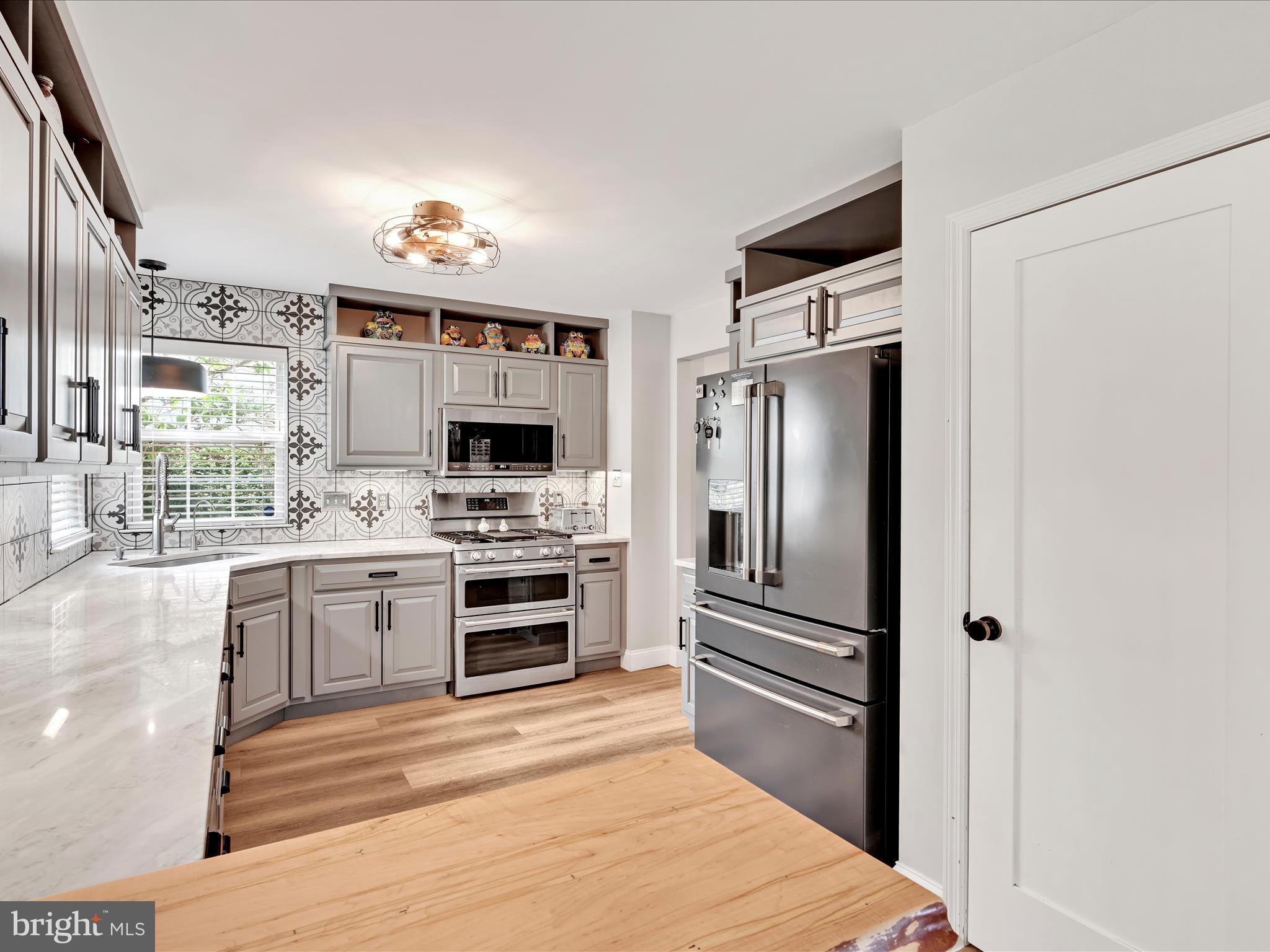 2518 Jacob Drive Reading, PA 19608 - Photo 14 of 41 a kitchen with a refrigerator and a stove top oven