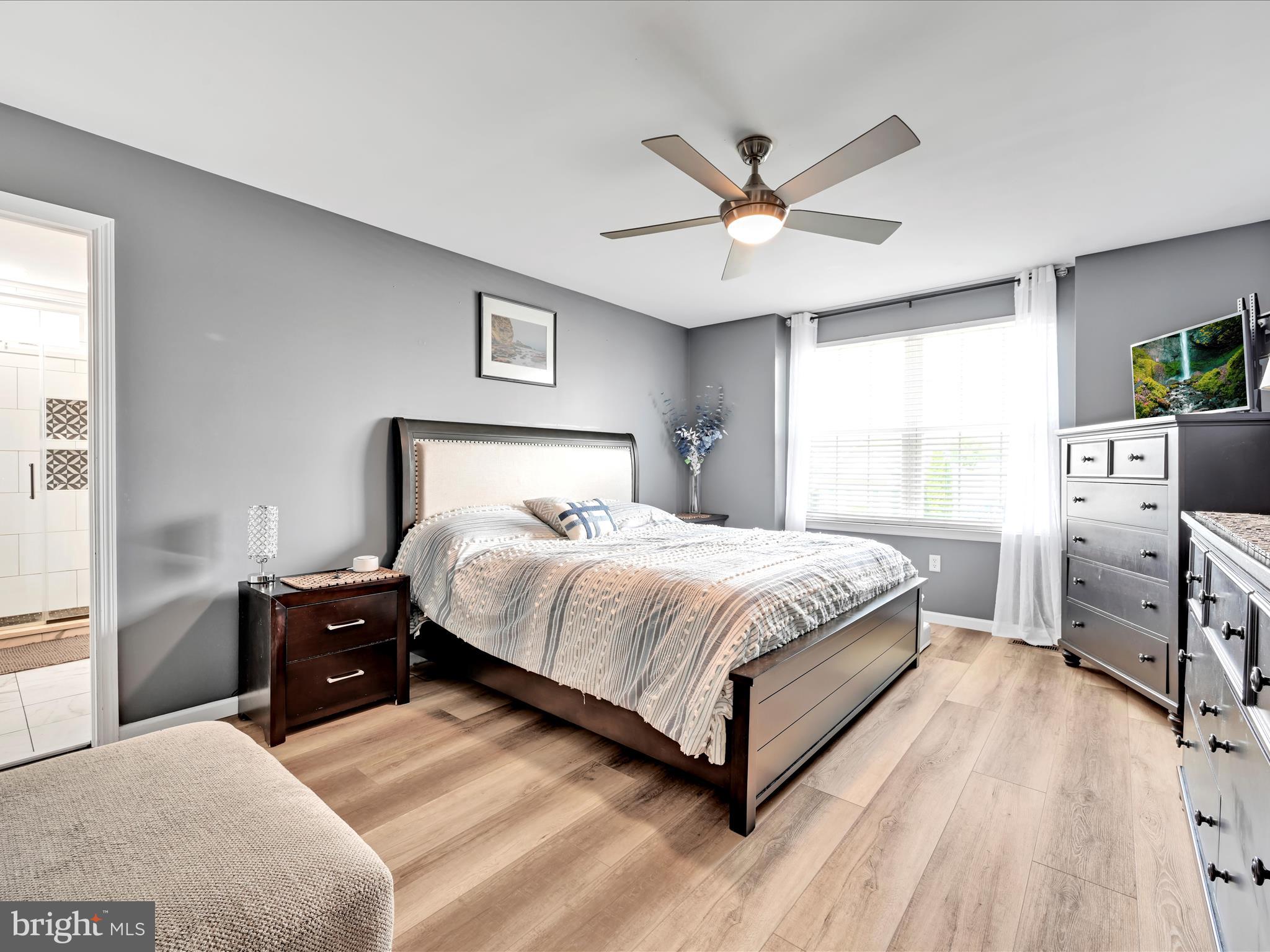 2518 Jacob Drive Reading, PA 19608 - Photo 22 of 41 a bedroom with a large bed and a chandelier