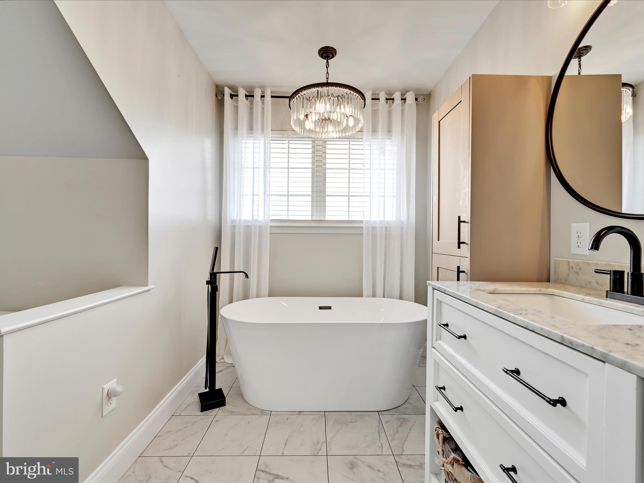 2518 Jacob Drive Reading, PA 19608 - Photo 25 of 41 a bathroom with a bathtub sink mirror and vanity
