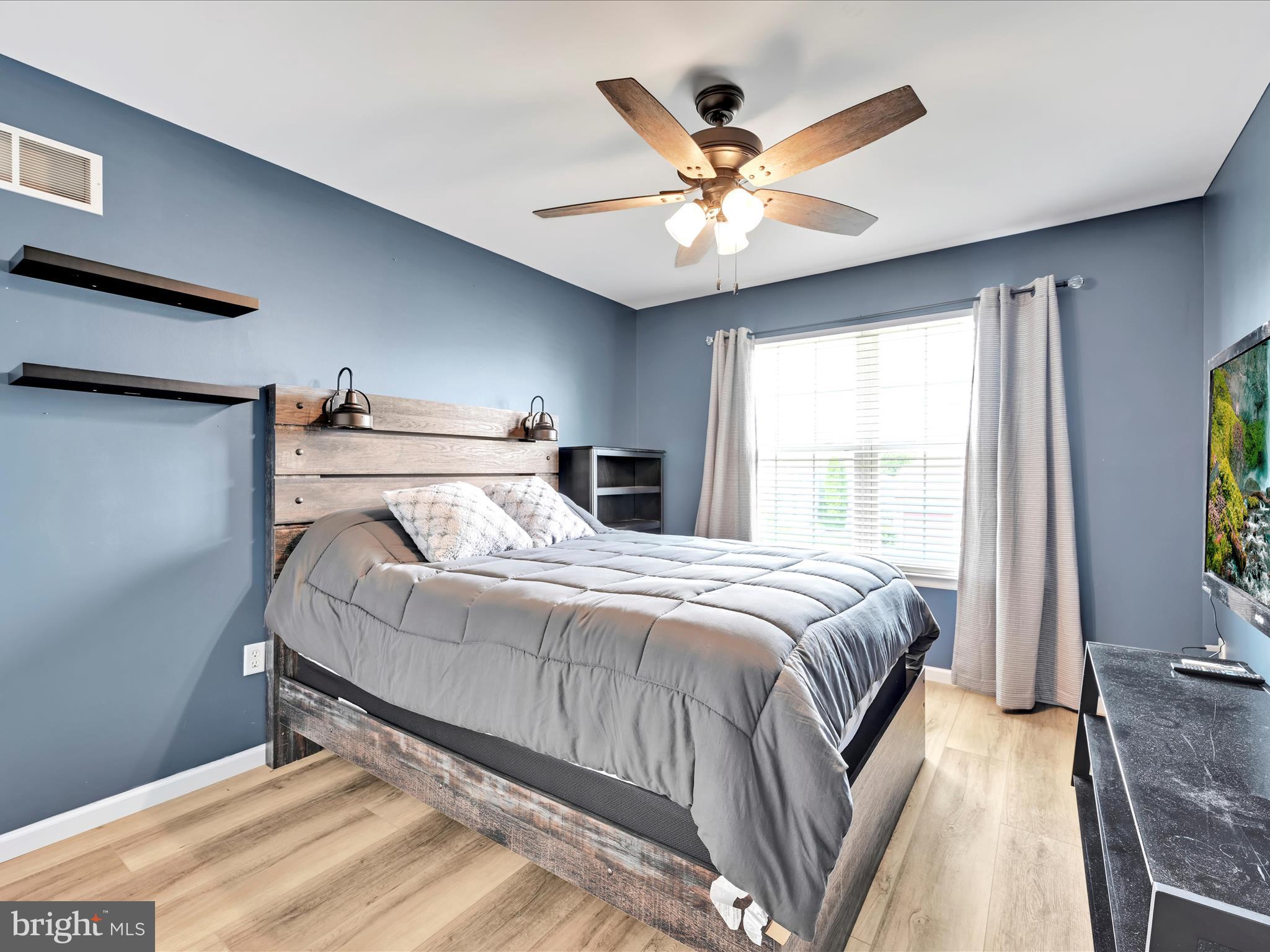 2518 Jacob Drive Reading, PA 19608 - Photo 32 of 41 a bedroom with a large bed and a large window