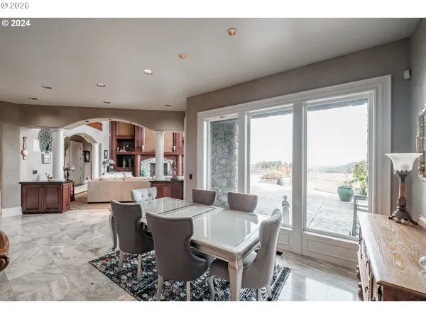 a living room with furniture a flat screen tv and a large window