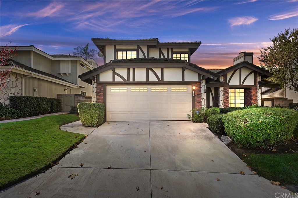 2646 Hampton Way Riverside, CA 92506 - Photo 1 of 1 a front view of a house with a yard and garage