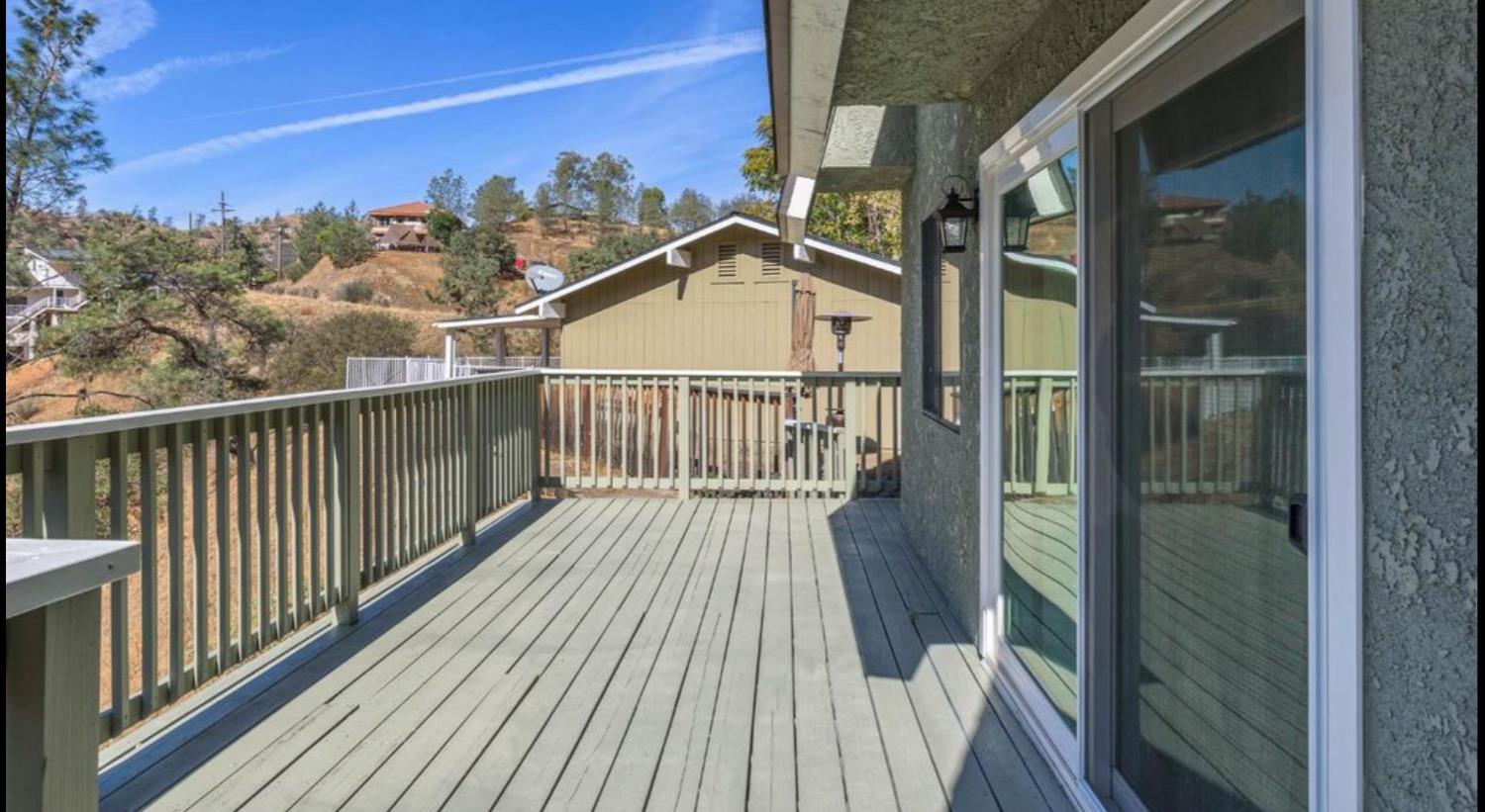 27817 Sky Harbour Road Friant, CA 93626 - Photo 5 of 36 a view of a balcony with wooden floor
