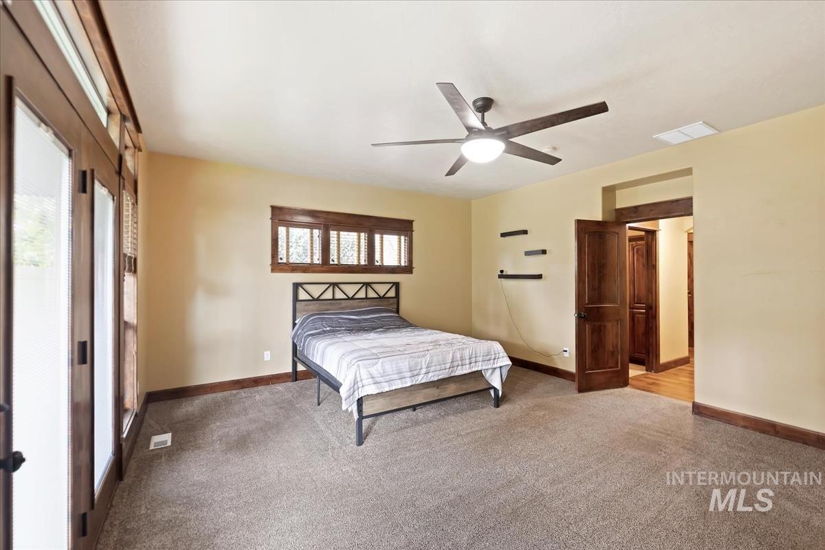 2543 West Divide Creek Street Meridian, ID 83646 - Photo 22 of 49 Bedroom featuring carpet flooring and a ceiling fan