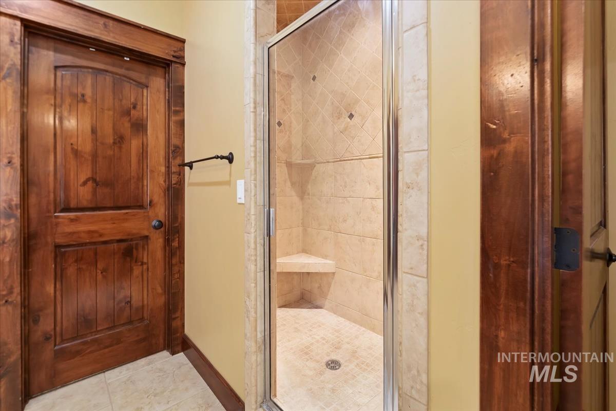 2543 West Divide Creek Street Meridian, ID 83646 - Photo 25 of 49 Full bath with a shower stall and tile patterned flooring