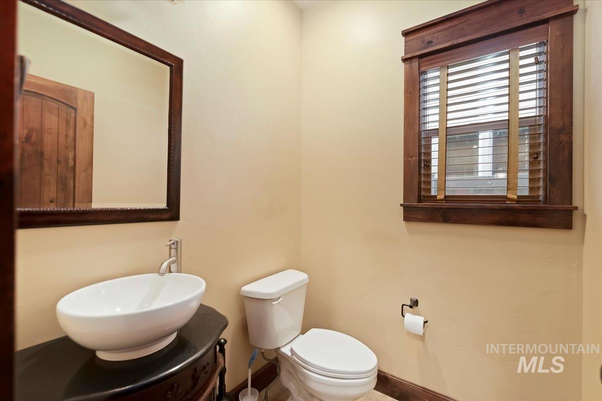 2543 West Divide Creek Street Meridian, ID 83646 - Photo 29 of 49 Half bath with vanity and baseboards