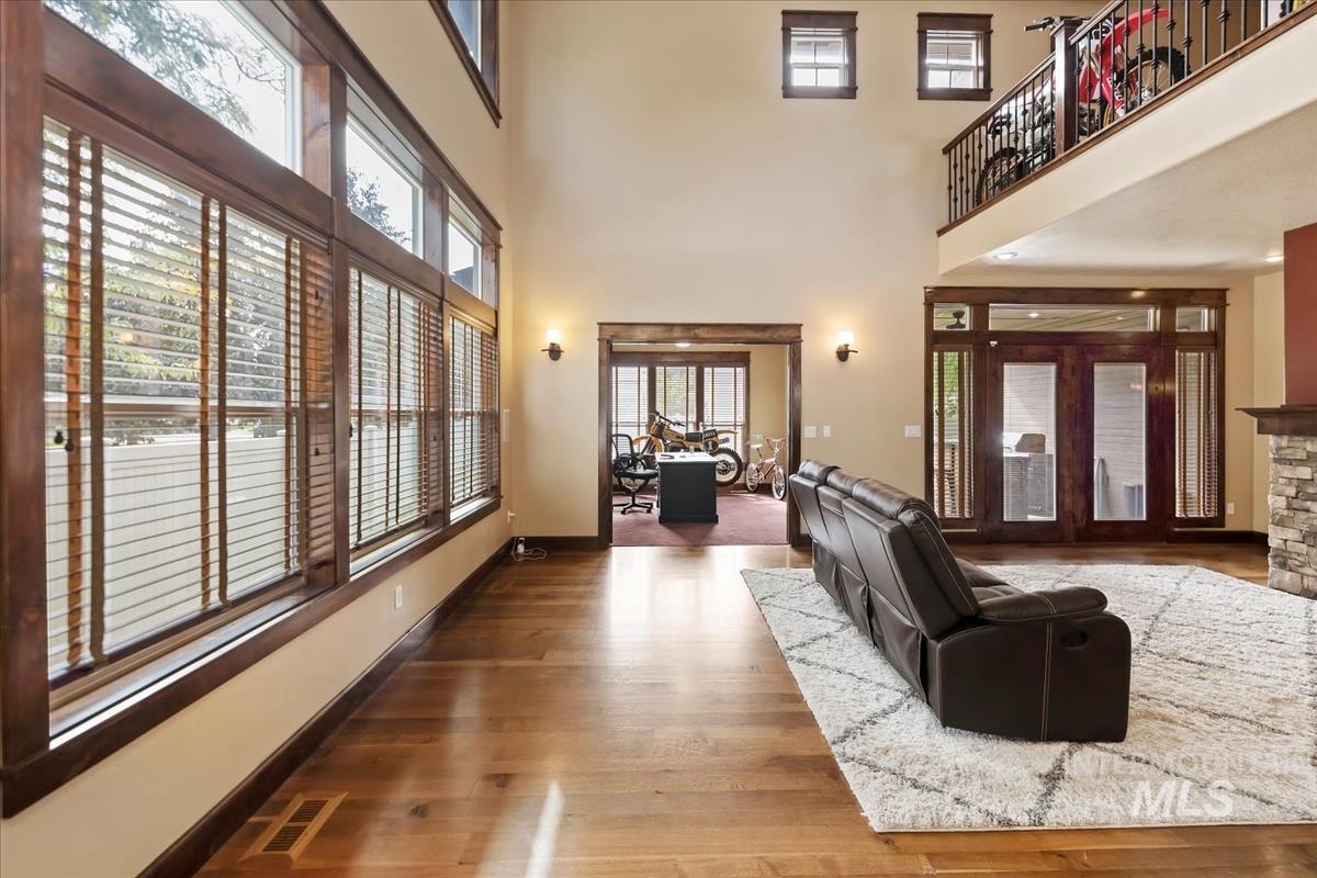 2543 West Divide Creek Street Meridian, ID 83646 - Photo 3 of 49 Living room with wood finished floors and a high ceiling