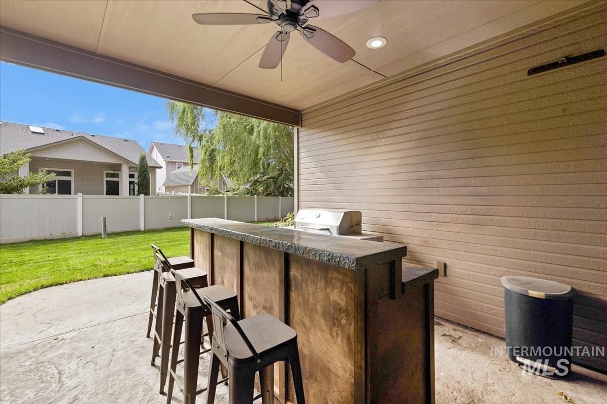 2543 West Divide Creek Street Meridian, ID 83646 - Photo 39 of 49 View of patio with ceiling fan and exterior kitchen