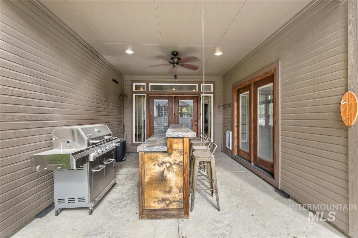 2543 West Divide Creek Street Meridian, ID 83646 - Photo 40 of 49 View of patio with ceiling fan, grilling area, and french doors