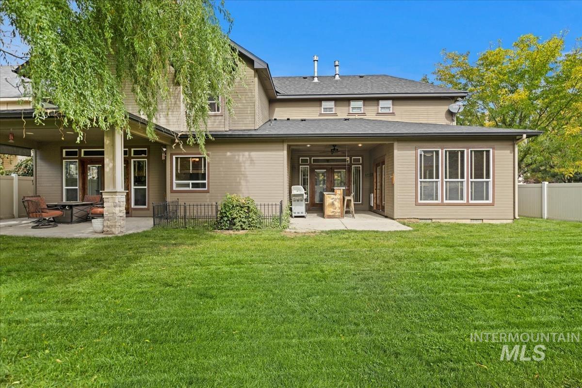2543 West Divide Creek Street Meridian, ID 83646 - Photo 44 of 49 Rear view of property with a patio area, a fenced backyard, and ceiling fan