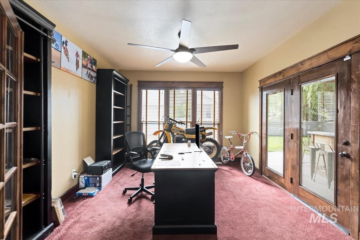 2543 West Divide Creek Street Meridian, ID 83646 - Photo 5 of 49 Office area with dark carpet and a ceiling fan