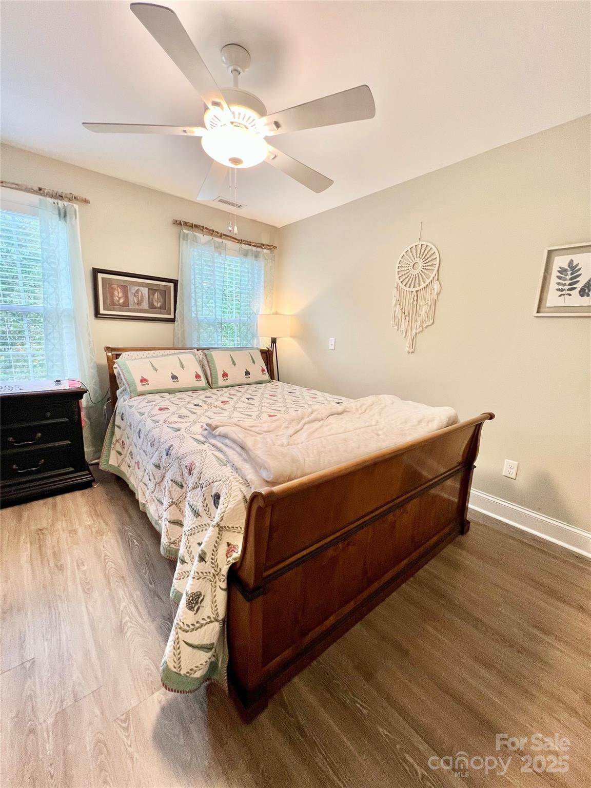 1781 17th Avenue Northeast Hickory, NC 28601 - Photo 11 of 26 a bed sitting in a bedroom and wooden floor