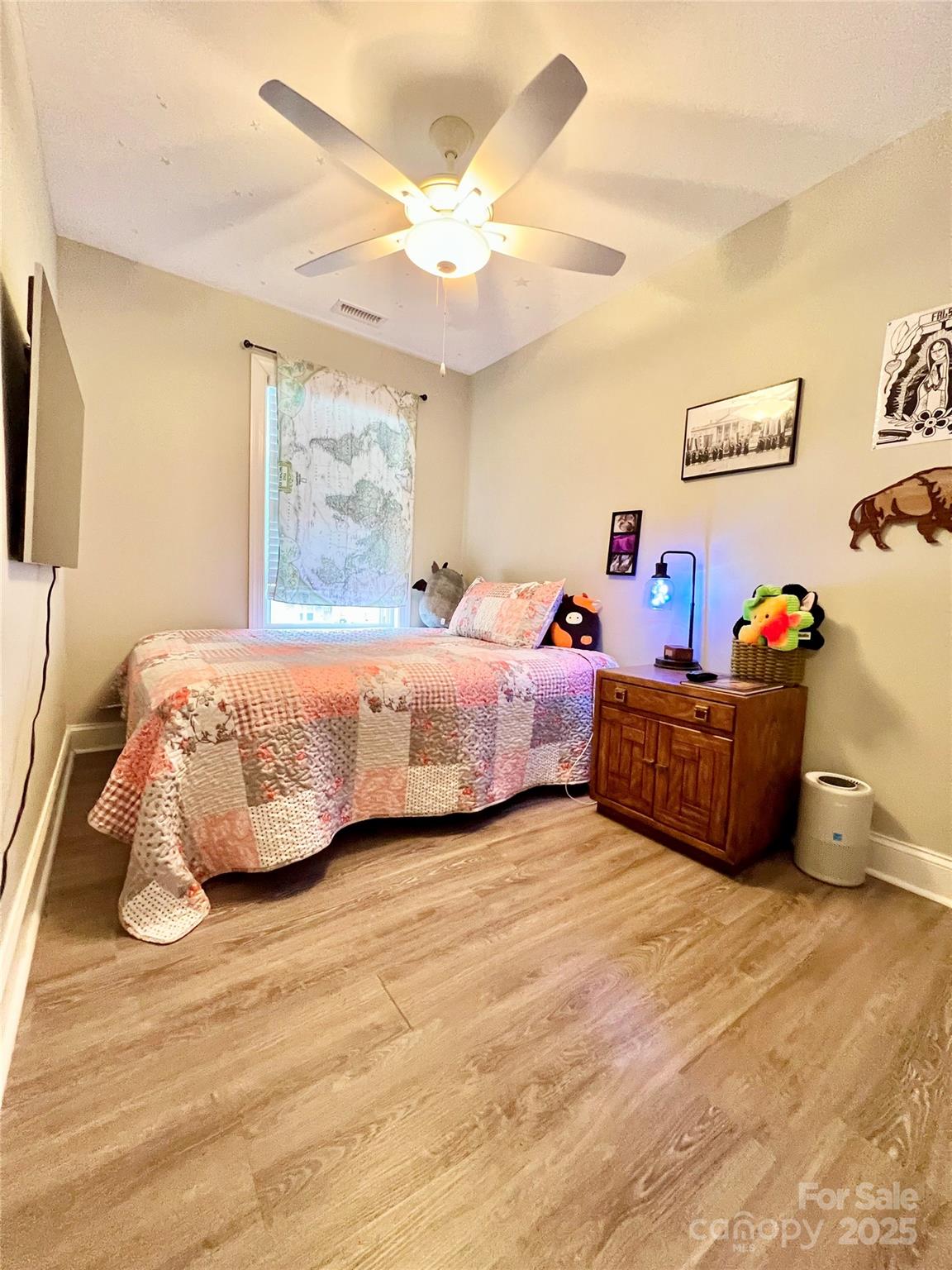 1781 17th Avenue Northeast Hickory, NC 28601 - Photo 15 of 26 a bedroom with a bed and a chandelier