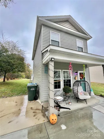 a view of a chair and tables in the patio
