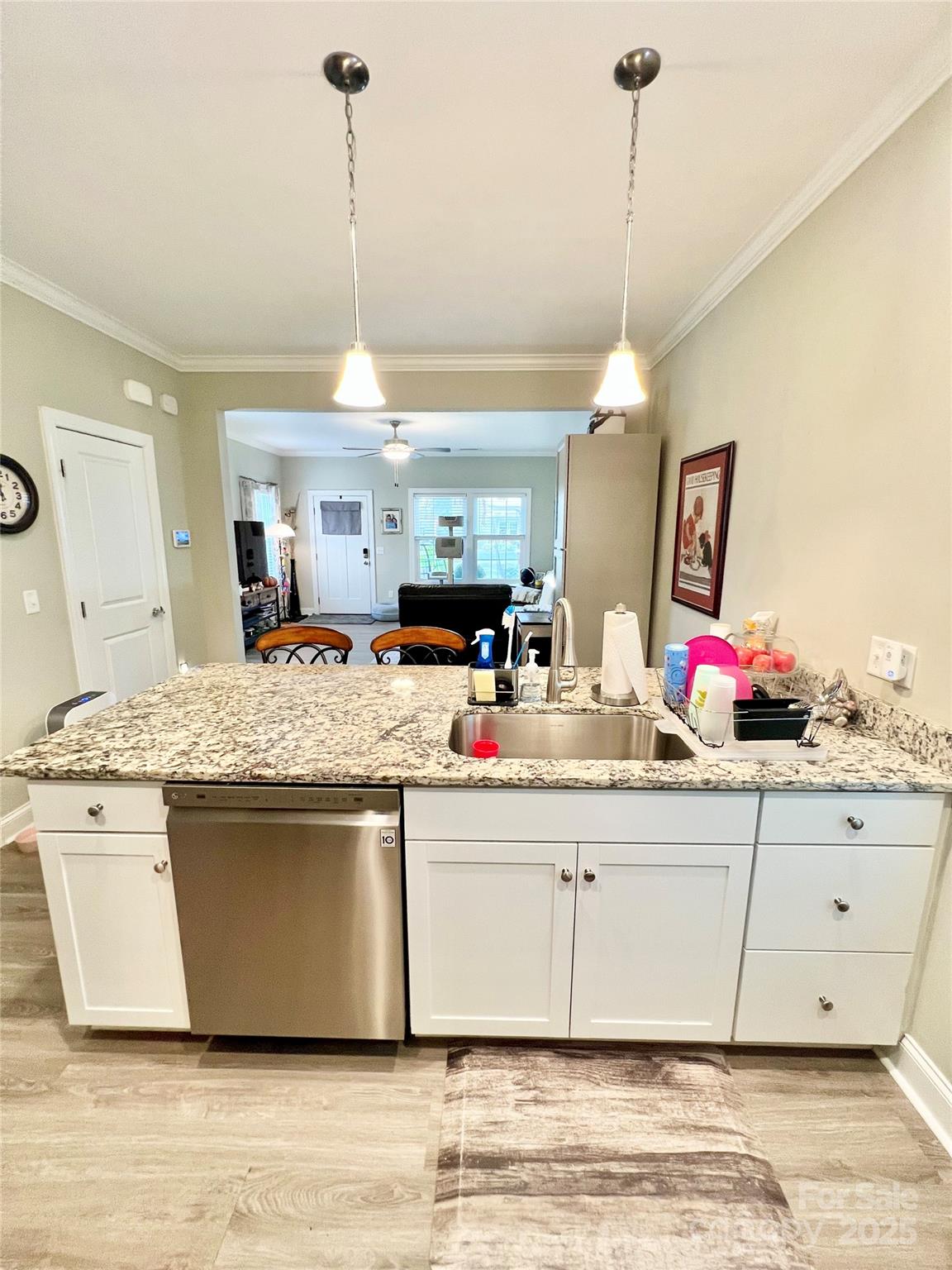 1781 17th Avenue Northeast Hickory, NC 28601 - Photo 4 of 26 a kitchen with kitchen island granite countertop a sink and a chandelier