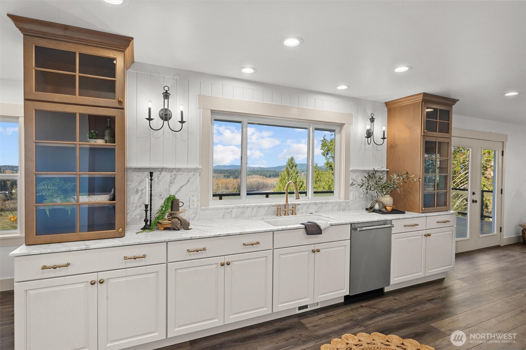 9813 Moran Road Arlington, WA 98223 - Photo 16 of 40 a view of cabinets a sink and dishwasher with wooden floor