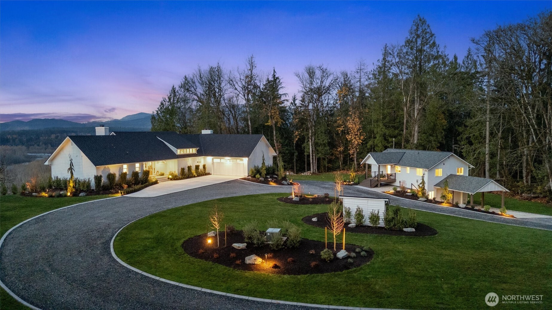9813 Moran Road Arlington, WA 98223 - Photo 2 of 40 a view of a garden with lawn chairs and a fire pit