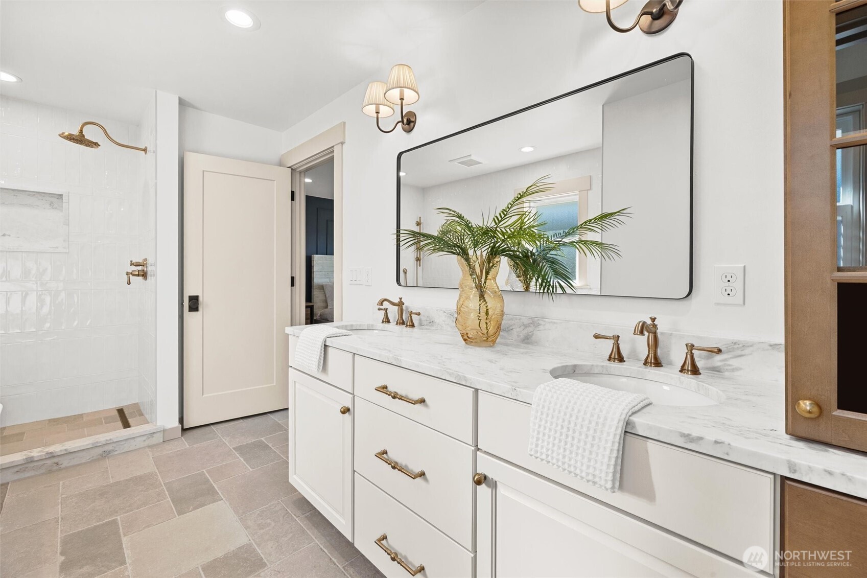 9813 Moran Road Arlington, WA 98223 - Photo 25 of 40 a bathroom with cabinets and mirror