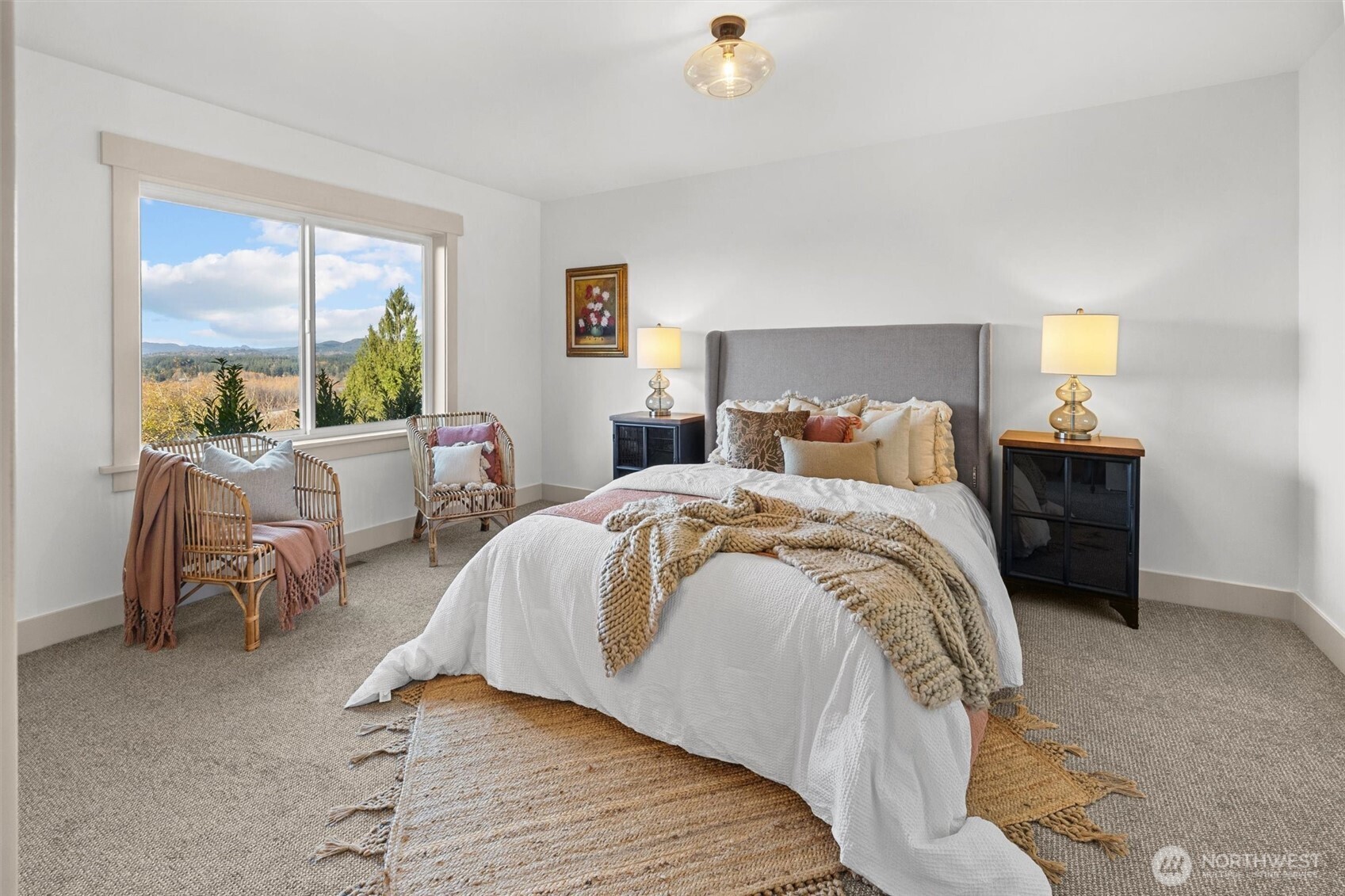 9813 Moran Road Arlington, WA 98223 - Photo 29 of 40 a bedroom with a bed and a large window