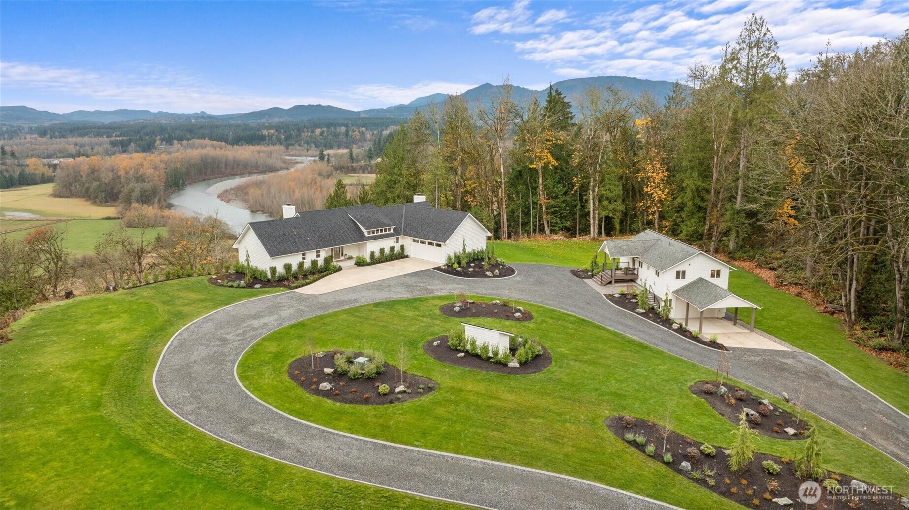 9813 Moran Road Arlington, WA 98223 - Photo 3 of 40 a view of a lake with a mountain in the background