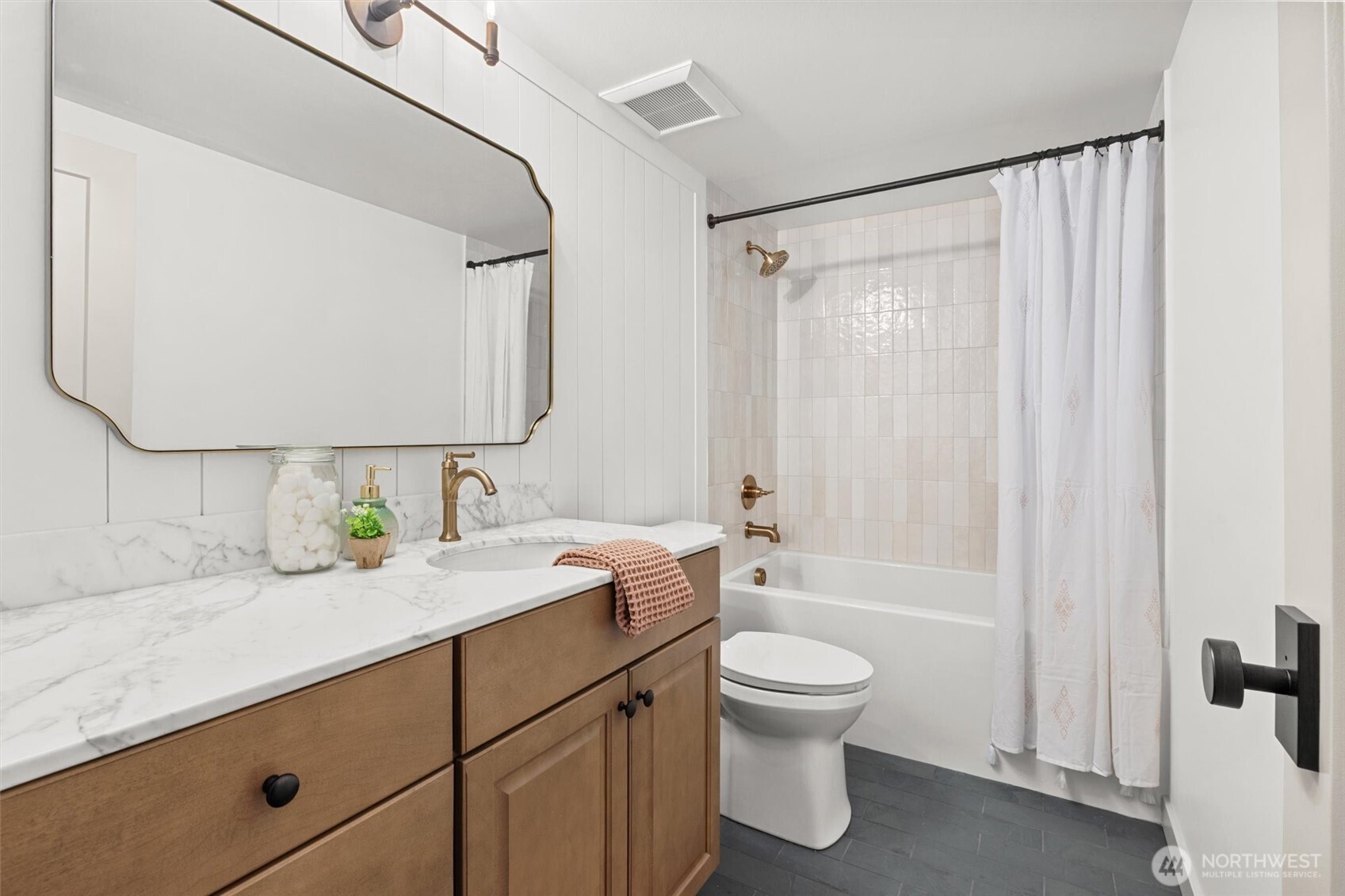 9813 Moran Road Arlington, WA 98223 - Photo 31 of 40 a bathroom with a granite countertop sink toilet a mirror a vanity and shower