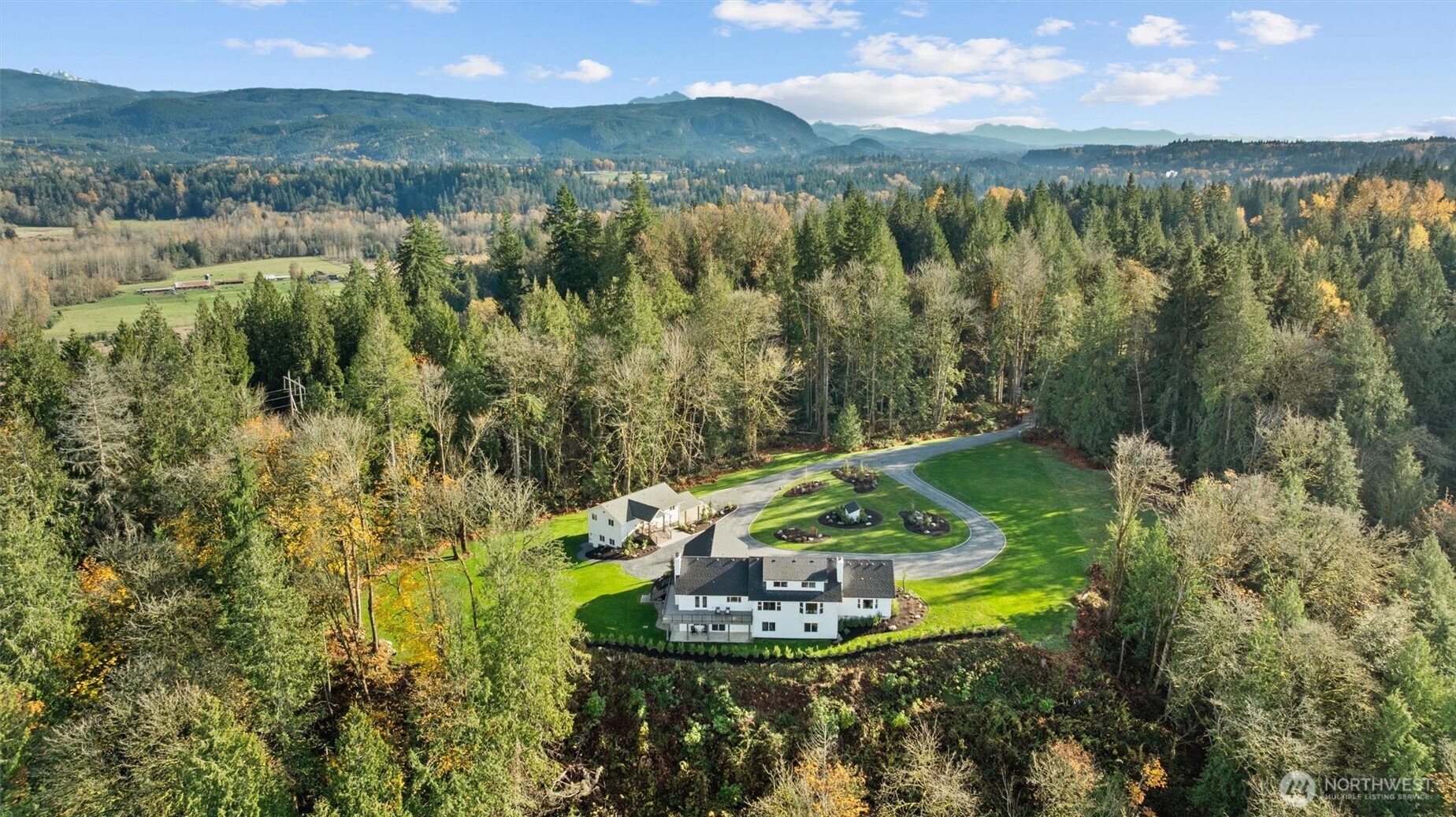 9813 Moran Road Arlington, WA 98223 - Photo 4 of 40 a view of a lake with a mountain in the background