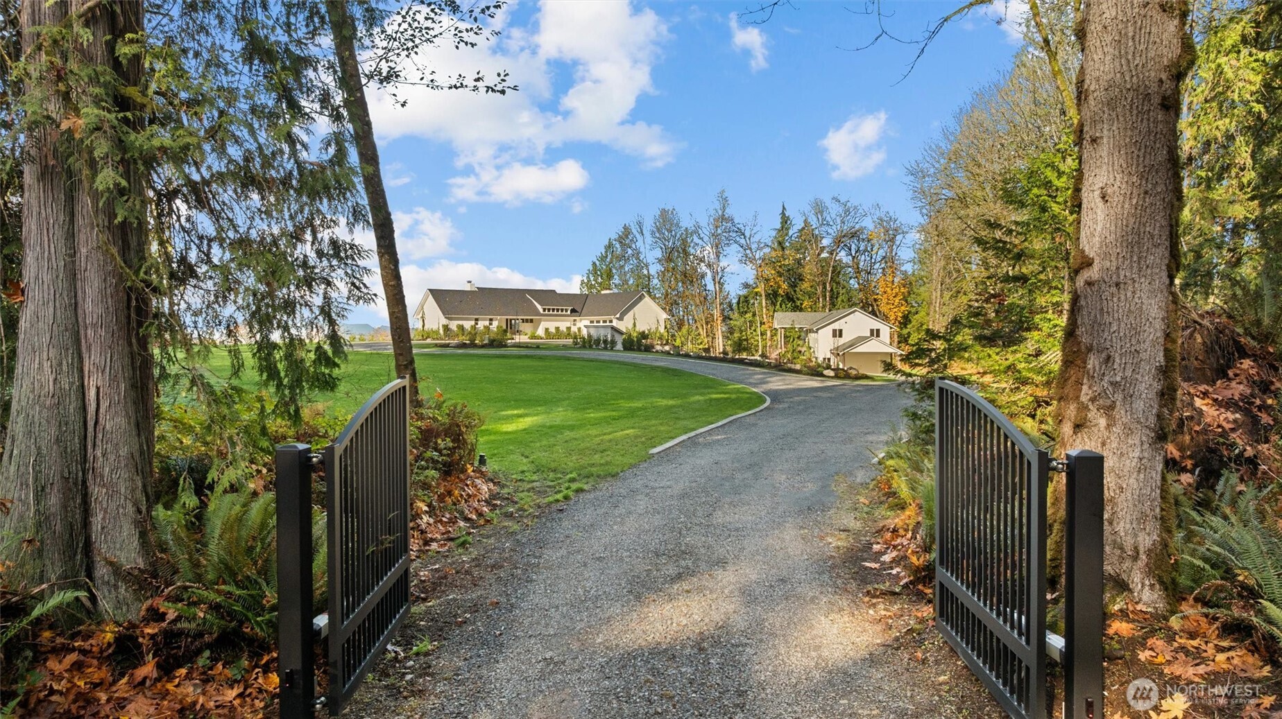 9813 Moran Road Arlington, WA 98223 - Photo 6 of 40 a view of a street with large trees