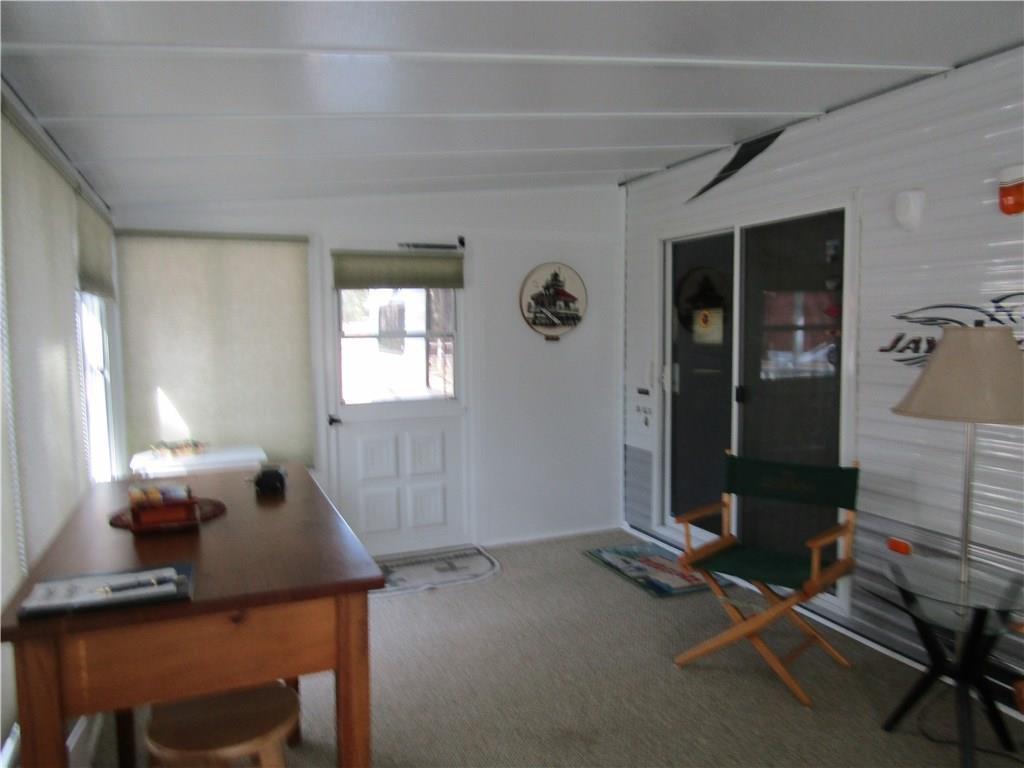 25 Indian Point Road, Unit 51 Raymond, ME 04071 - Photo 10 of 16 Sliding door leading from living...