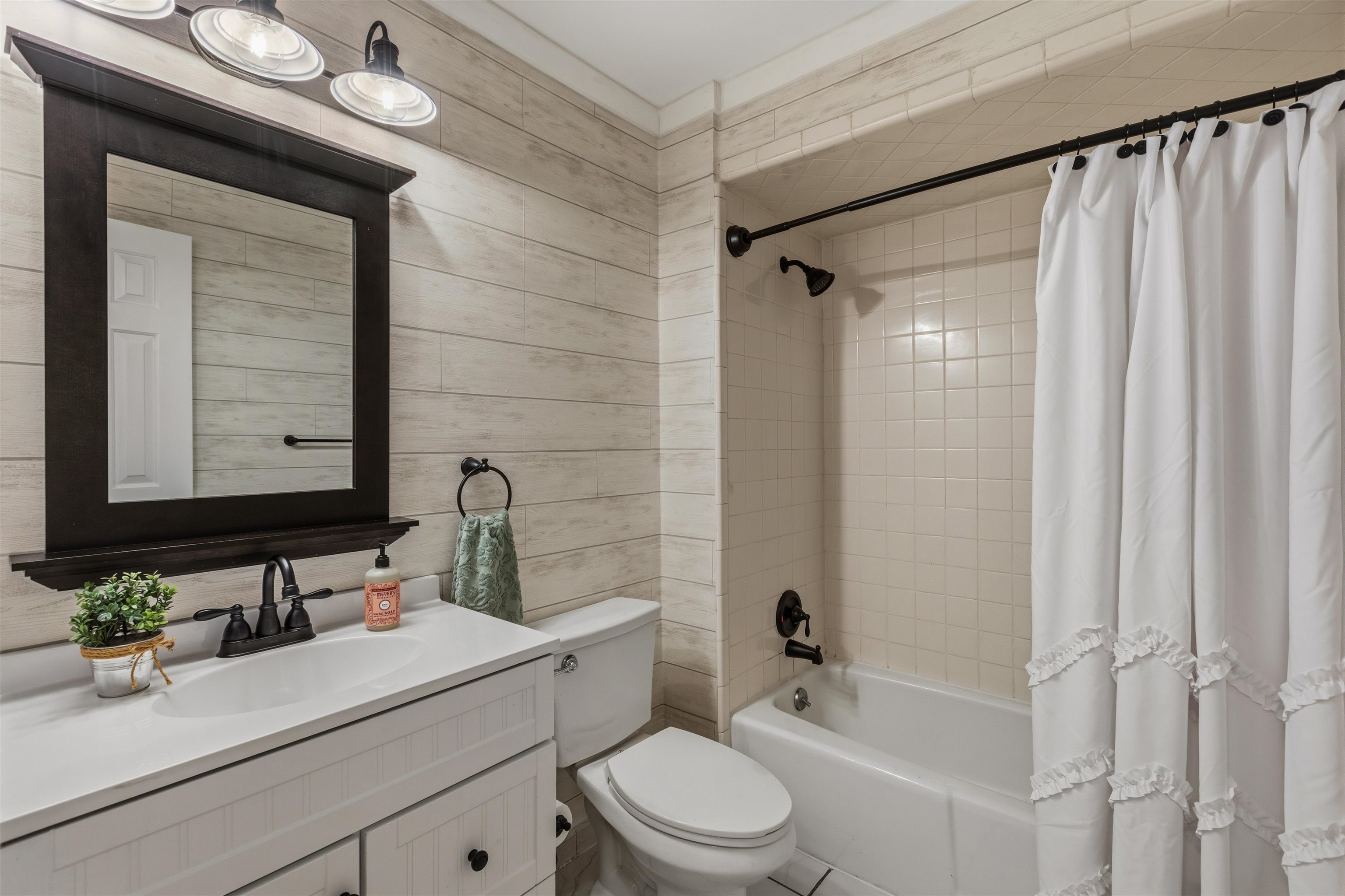 115 West Powell Road Collierville, TN 38017 - Photo 11 of 17 a bathroom with a sink a toilet and shower