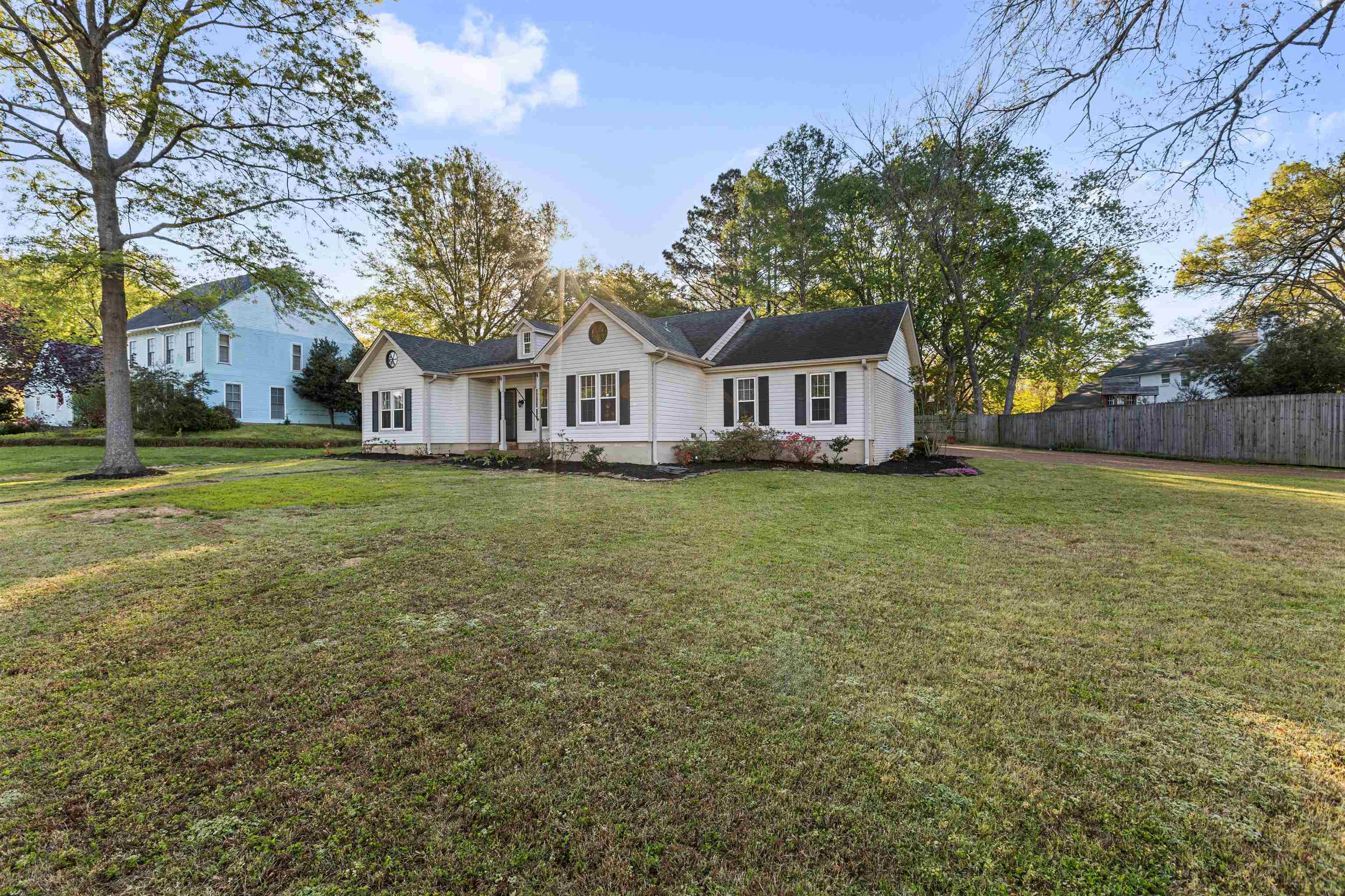 115 West Powell Road Collierville, TN 38017 - Photo 16 of 17 a view of a house with a big yard and large trees