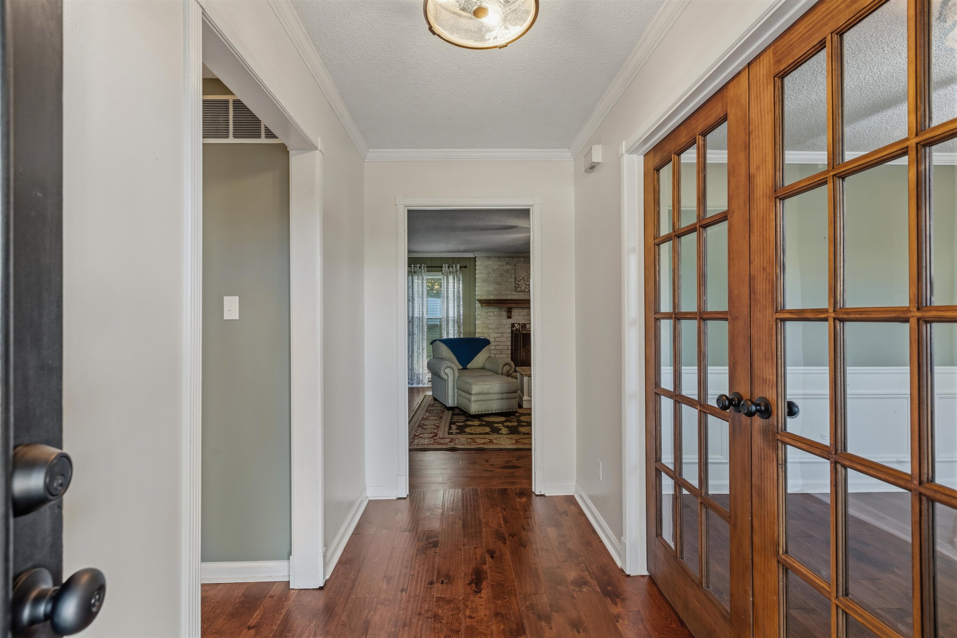 115 West Powell Road Collierville, TN 38017 - Photo 2 of 17 a view of a hallway with wooden floor and stairs
