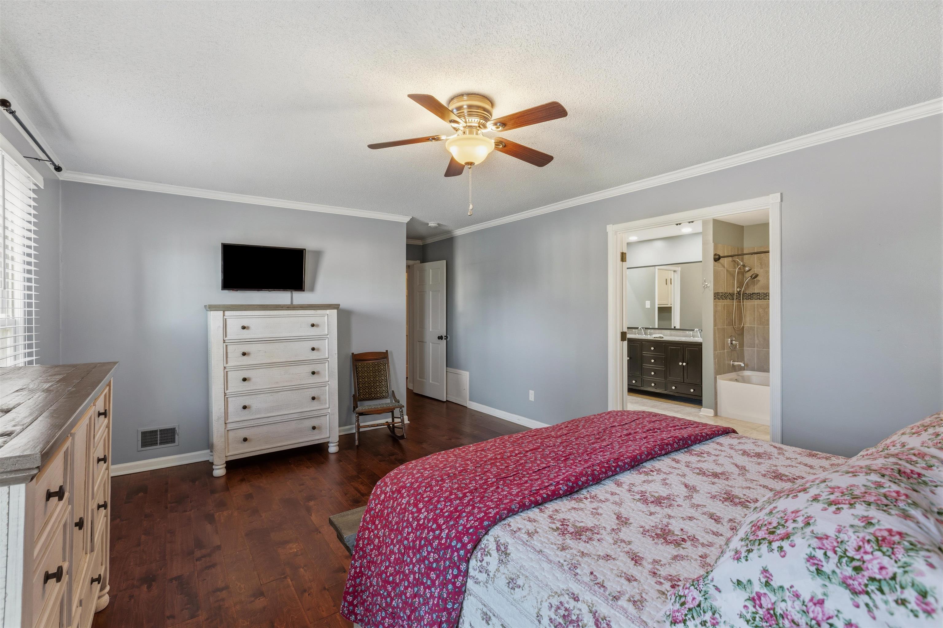 115 West Powell Road Collierville, TN 38017 - Photo 8 of 17 a bedroom with a bed and a television