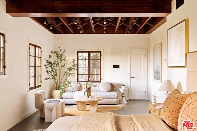 a bedroom with a bed and wooden furniture