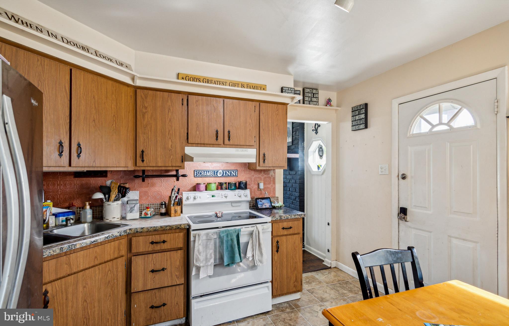 361 Salem Hancocks Bridge Road Salem, NJ 08079 - Photo 5 of 11 a kitchen with stainless steel appliances a stove a refrigerator a sink a cabinets and wooden floor