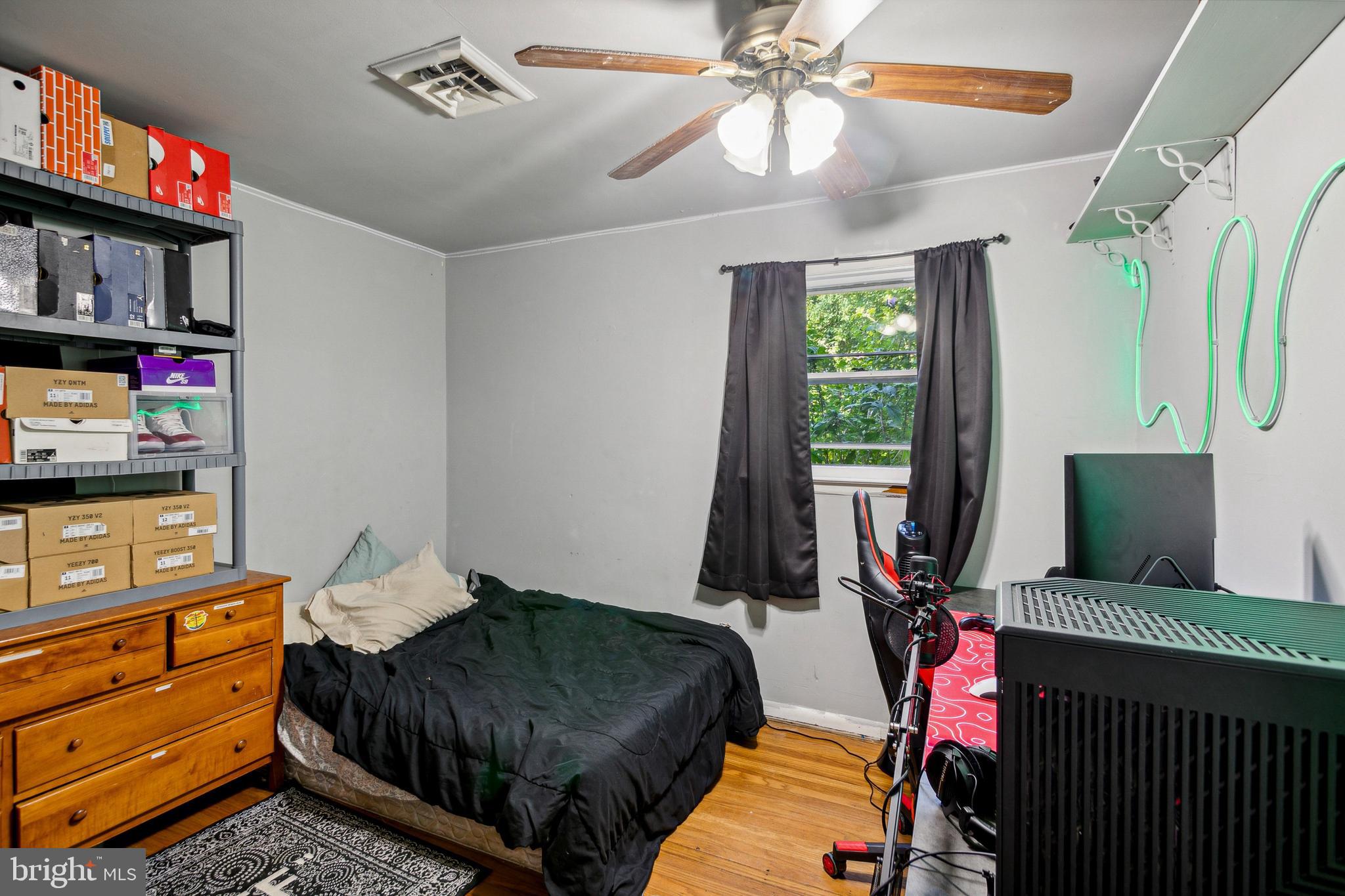 361 Salem Hancocks Bridge Road Salem, NJ 08079 - Photo 10 of 11 a bedroom with a bed a flat screen tv and a window