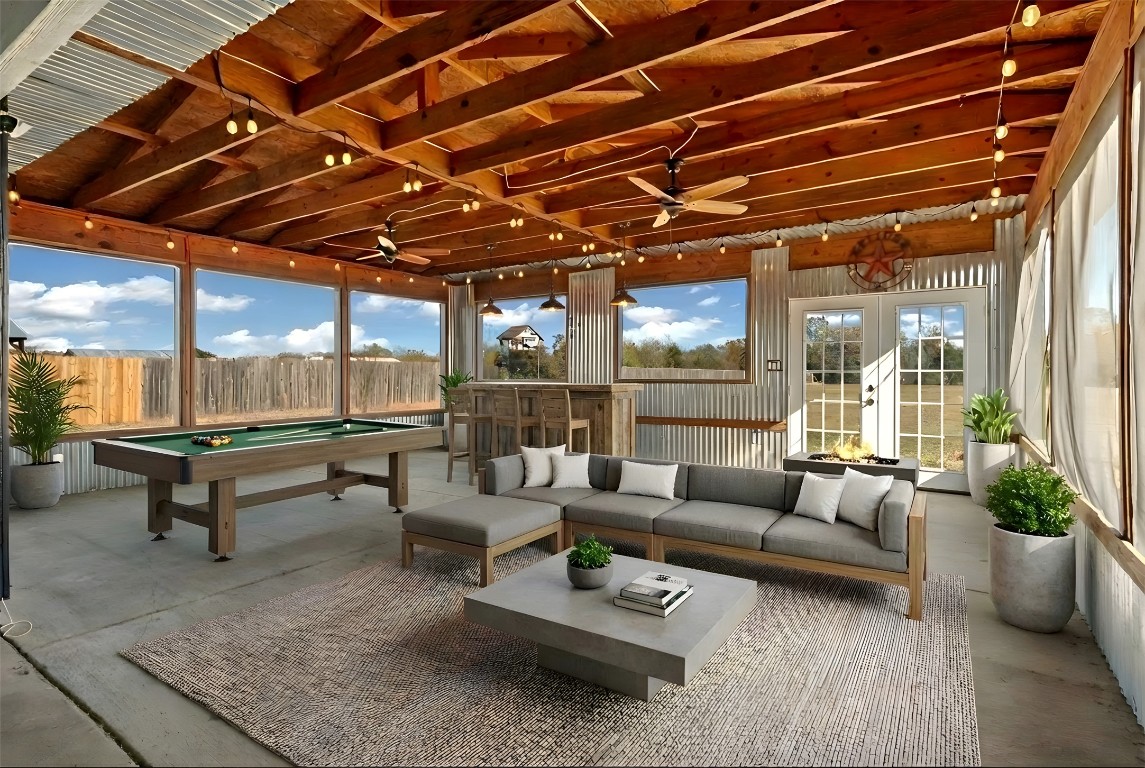167 Hay Meadow Road Cedar Creek, TX 78612 - Photo 2 of 39 Virtually staged - Covered sunroom with a ceiling fan, outdoor lounge area, a patio, and concrete flooring