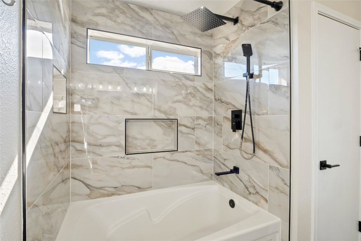 167 Hay Meadow Road Cedar Creek, TX 78612 - Photo 21 of 39 Primary bathroom with a combined bath / shower with marble appearance