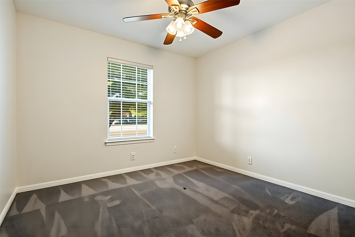167 Hay Meadow Road Cedar Creek, TX 78612 - Photo 24 of 39 Bedroom #2 featuring a ceiling fan, dark carpet and a ceiling fan