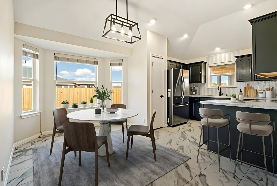 167 Hay Meadow Road Cedar Creek, TX 78612 - Photo 8 of 39 Virtually staged - Dining area featuring tile flooring, vaulted ceiling, and recessed lighting