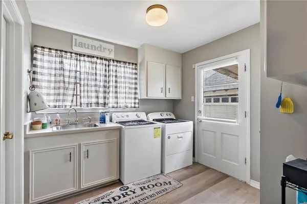 a kitchen with a sink cabinets and window