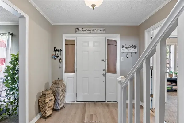 a view of entryway with wooden floor