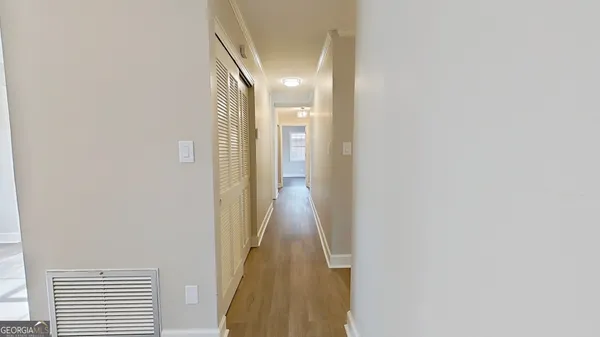 a view of a hallway with a white walls