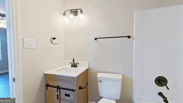 a bathroom with a toilet and a sink