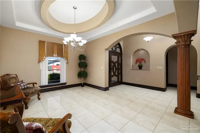 a view of a livingroom with furniture and chandelier