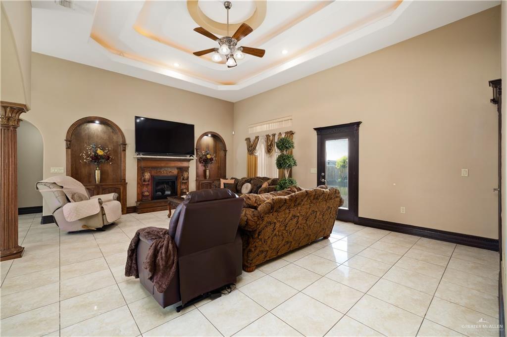 1257 Riverside Street Rio Grande City, TX 78582 - Photo 6 of 28 a living room with fireplace furniture and a chandelier