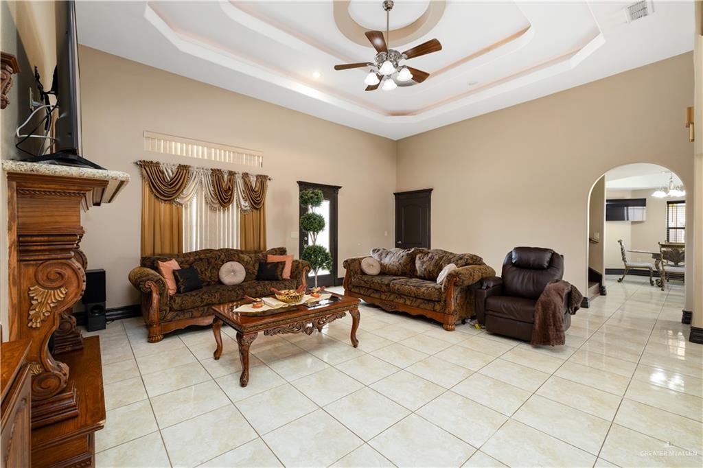 1257 Riverside Street Rio Grande City, TX 78582 - Photo 7 of 28 a living room with furniture and a chandelier